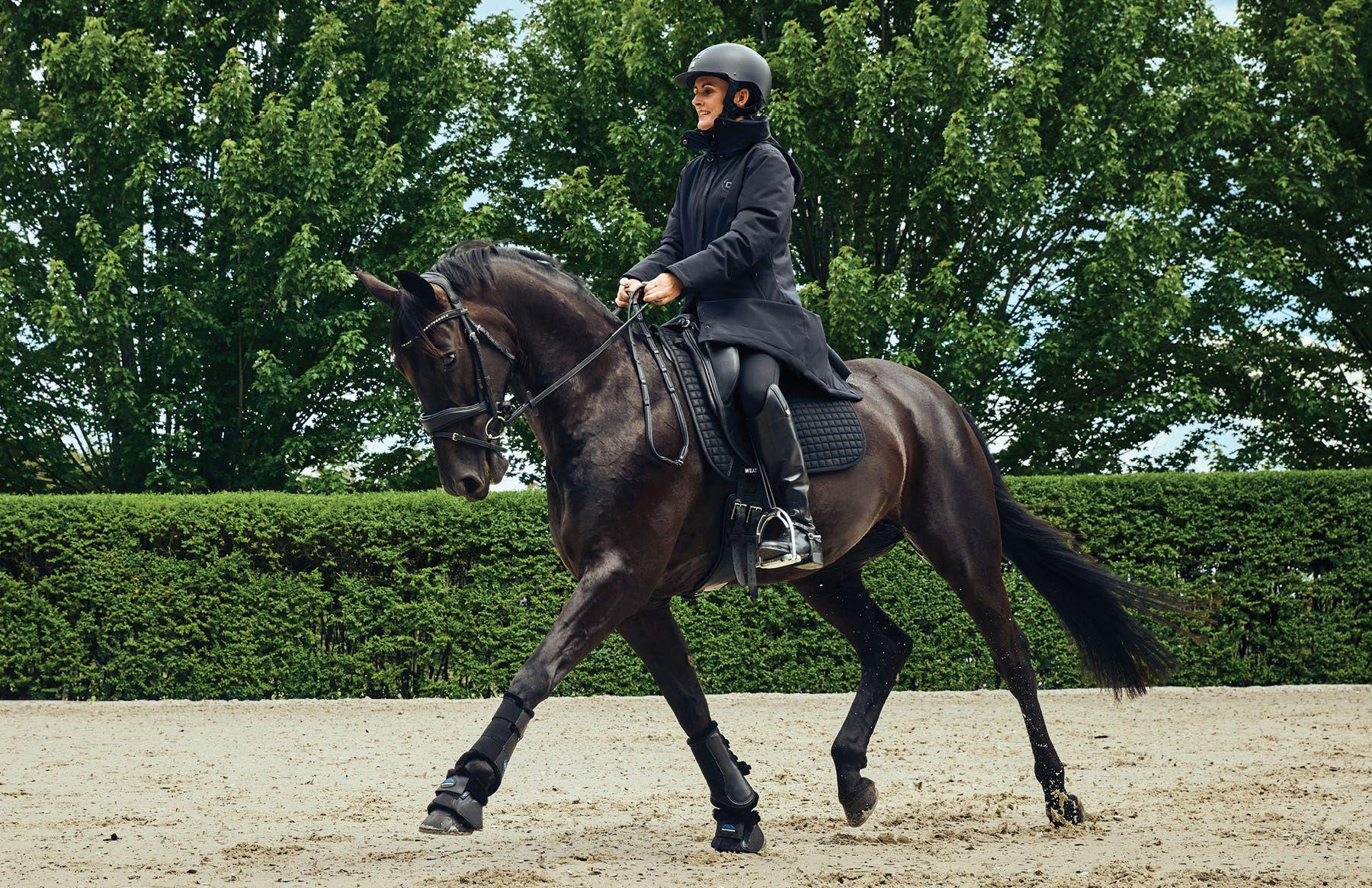 Model wearing Dublin jacket riding a horse