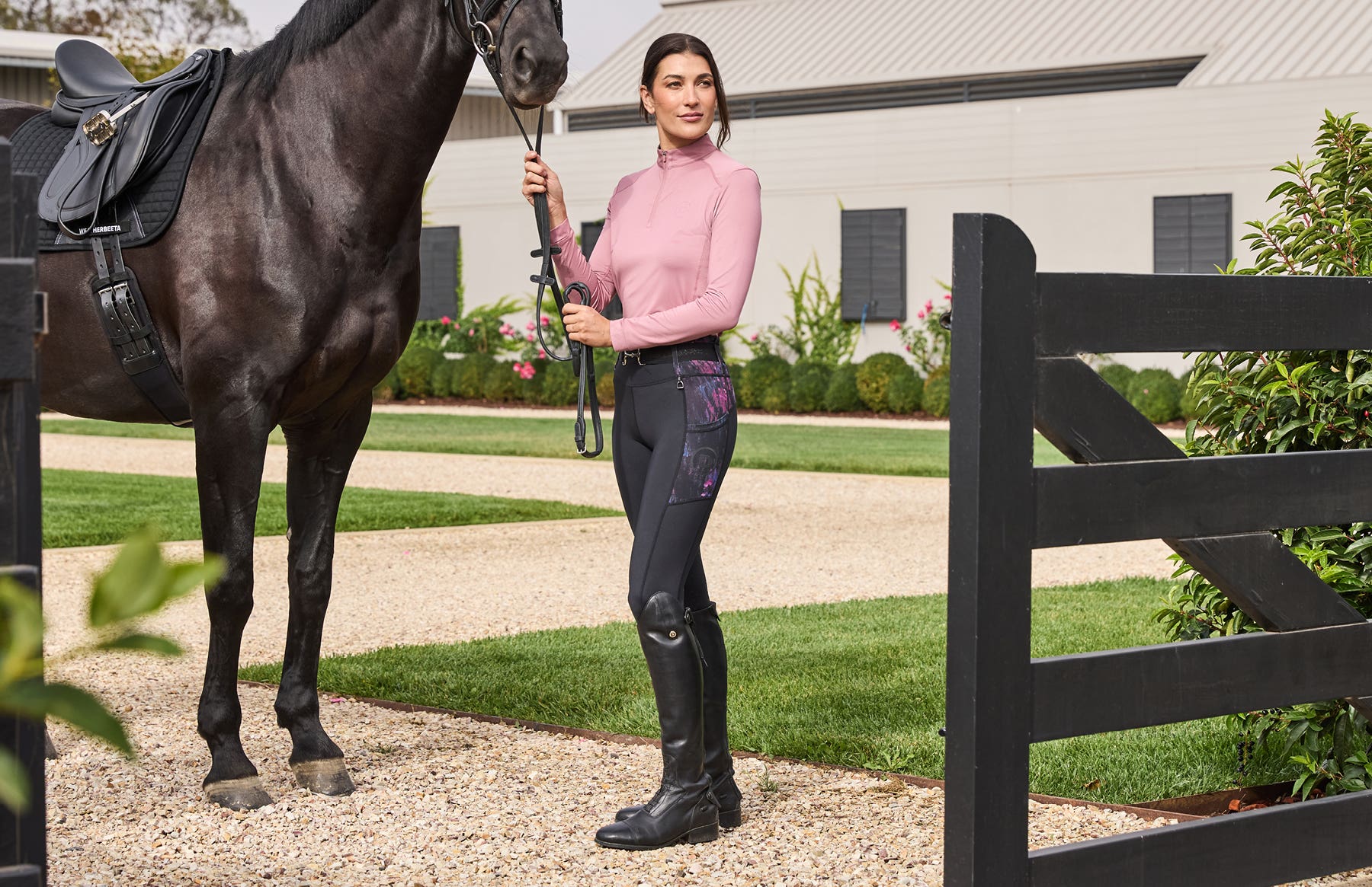Model holding horse wearing Dublin Clothing